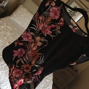 Beautiful flattering asymmetrical hem peplum top